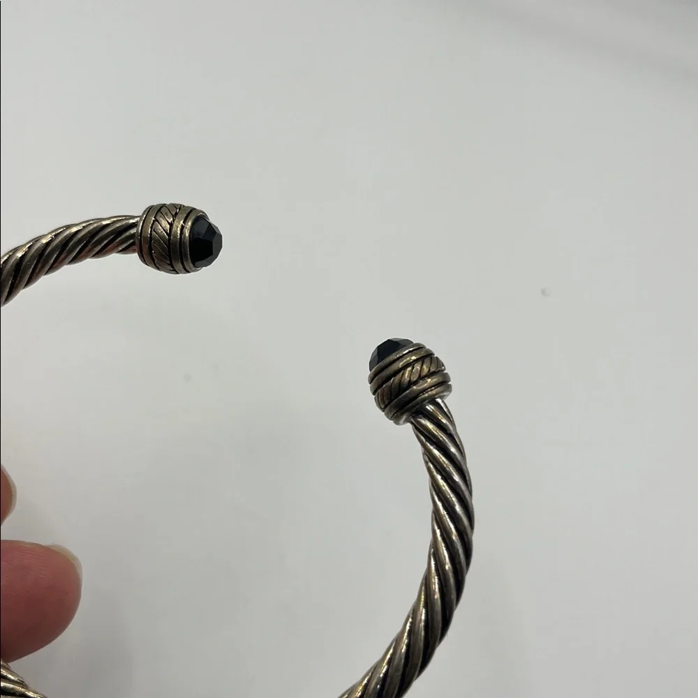 TWISTED CUFF BRACELET WITH MULTIFACETED BLACK GLASS BEADED ENDS
